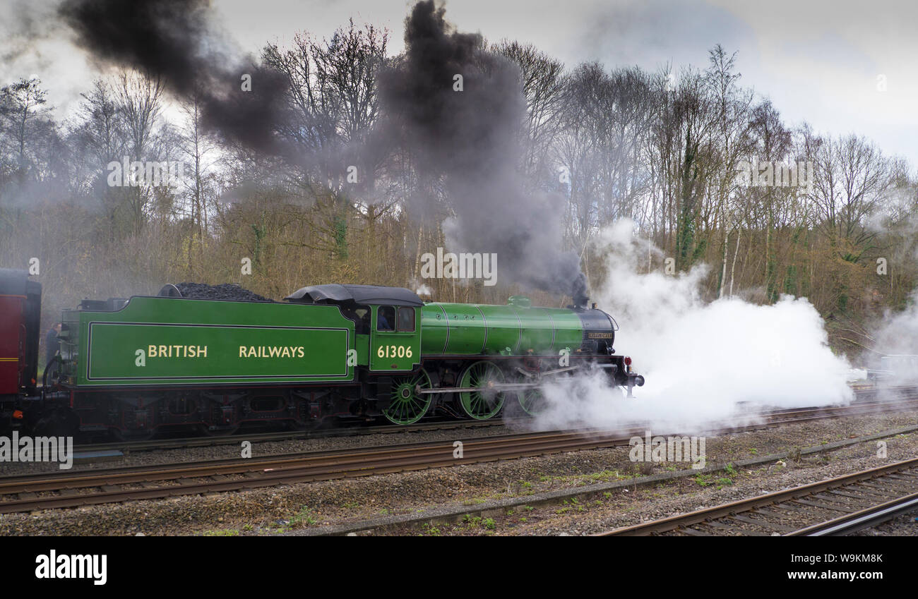B1 Class loco 61306 Mayflower lets of steam heading off from Winchfield ...
