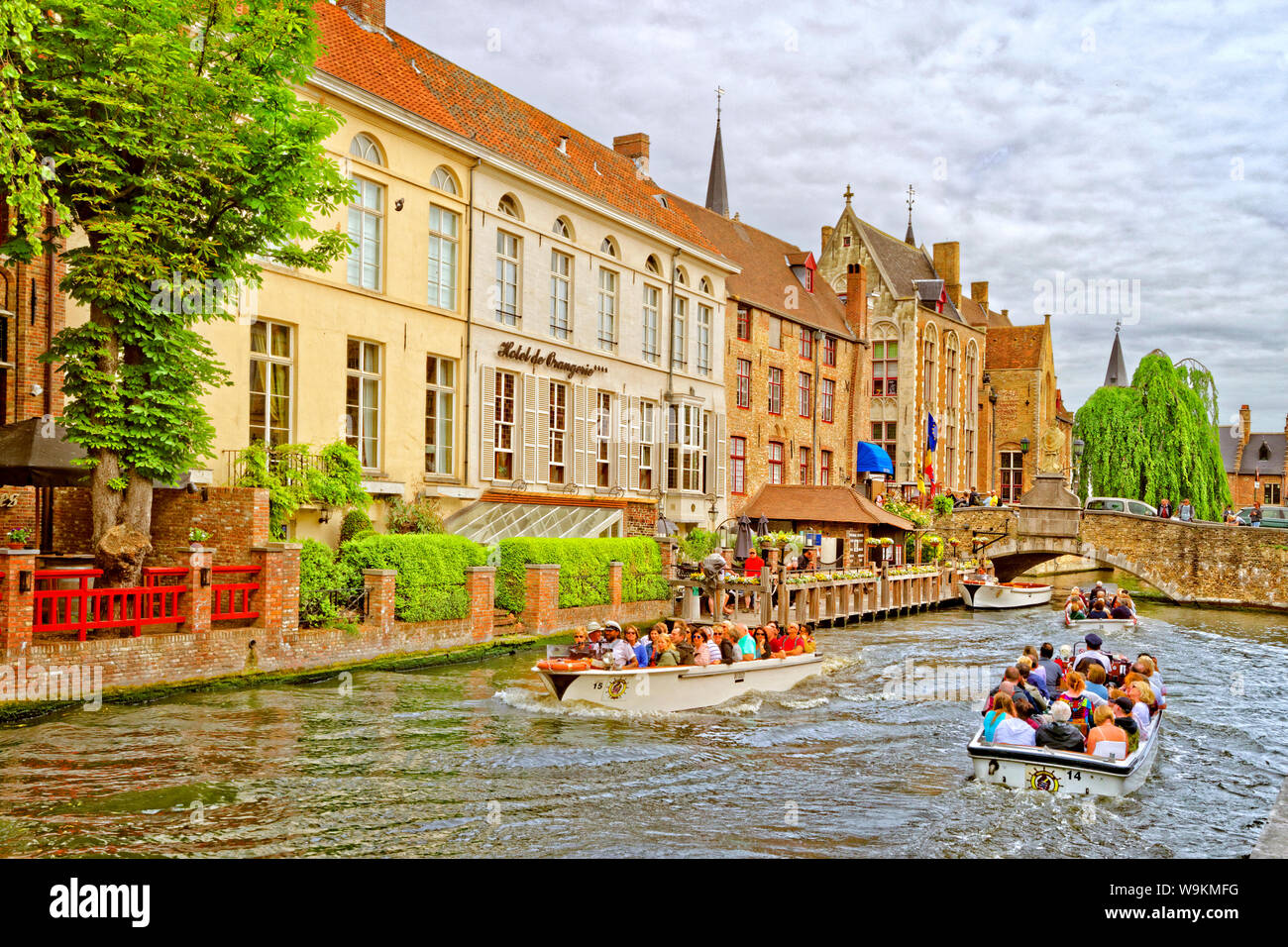 Tourist boats on the canals of Bruges, Belgium. Stock Photo