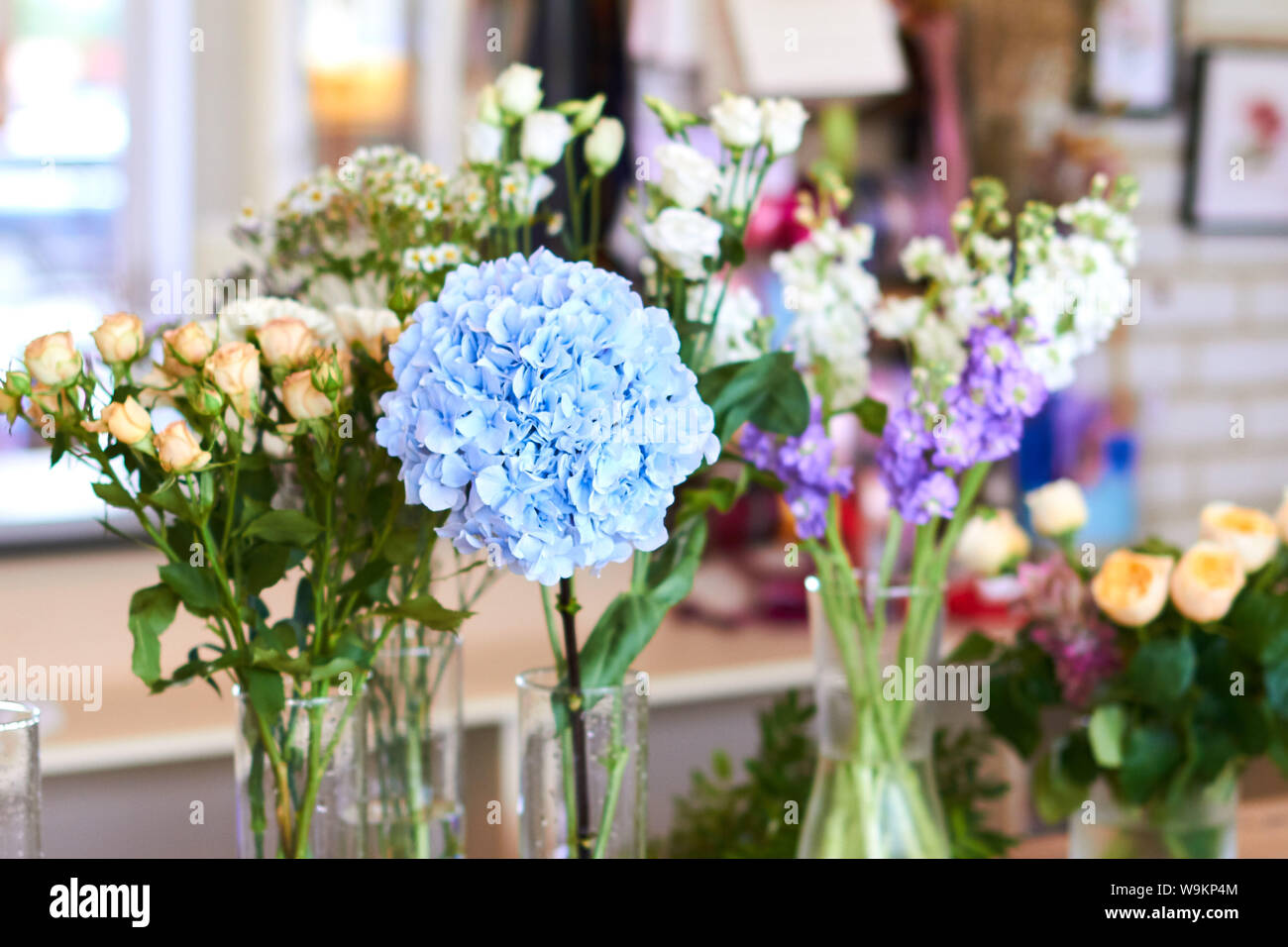 Variety Of Beautiful Flowers In Vases On Display Indoors Business