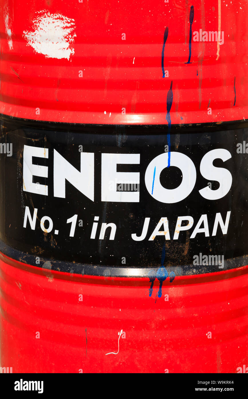 25 gallon Eneos Oil drum. Red and black , with paint oil stains. Zygi harbour,  Cyprus October 2018 Stock Photo