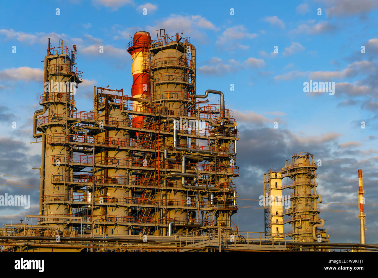 large complex of packed distillation columns and heating furnace in a ...