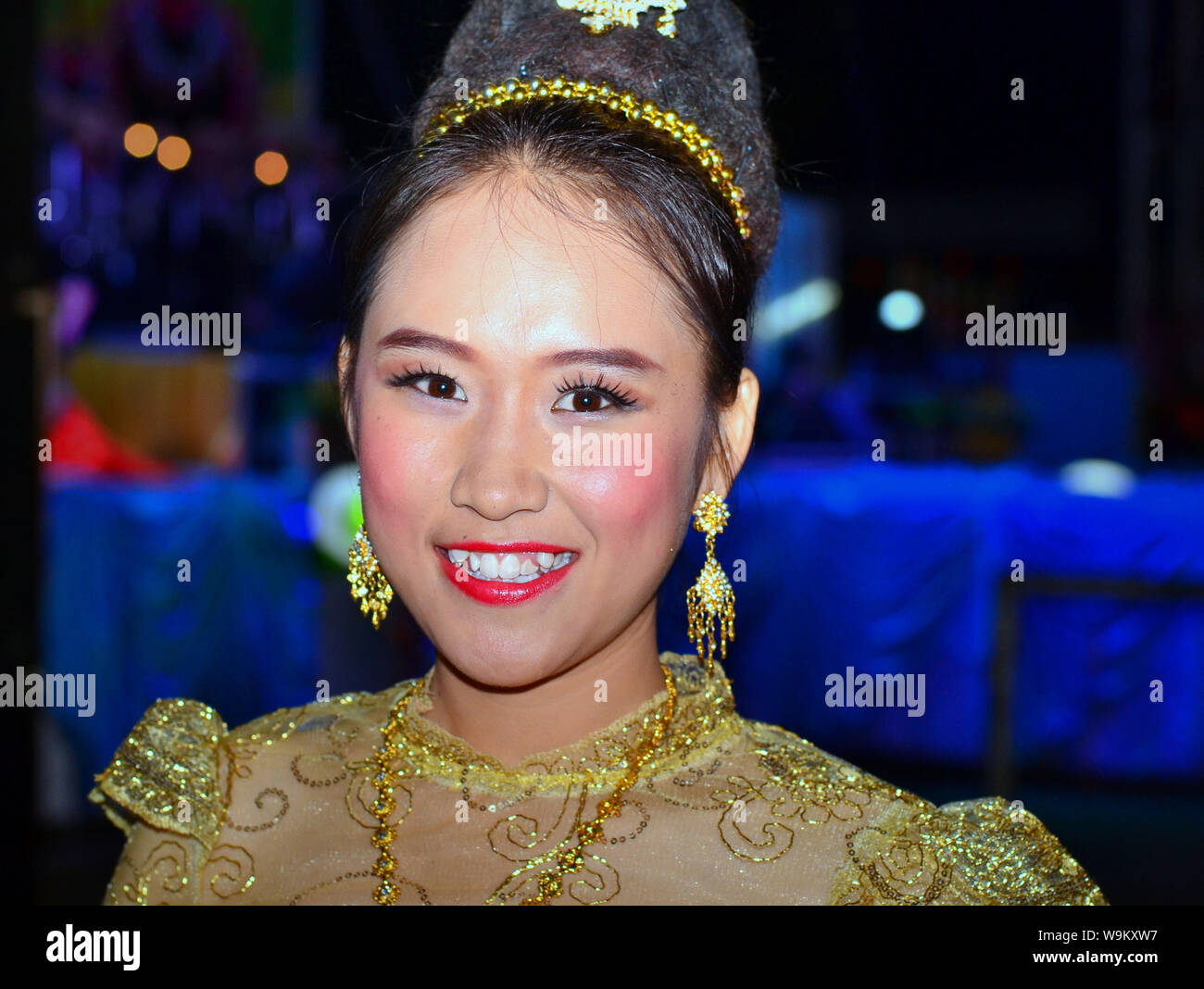 Dressed Up Thai Girl Wears A Golden Lanna Style Lace Dress And Elaborate Hairdo With Hair