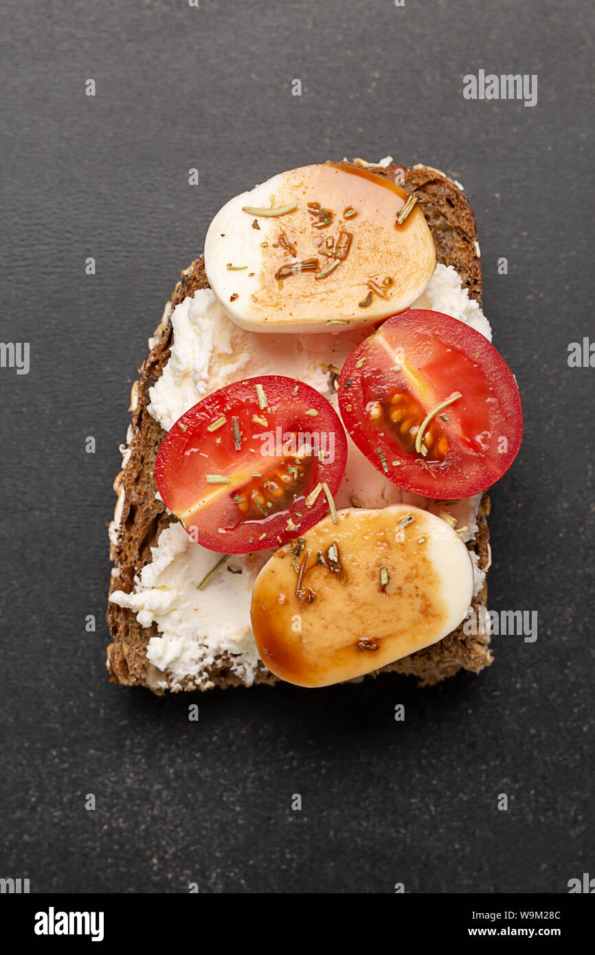 Open sandwich with feta cheese, tomatoes, cucumber Stock Photo