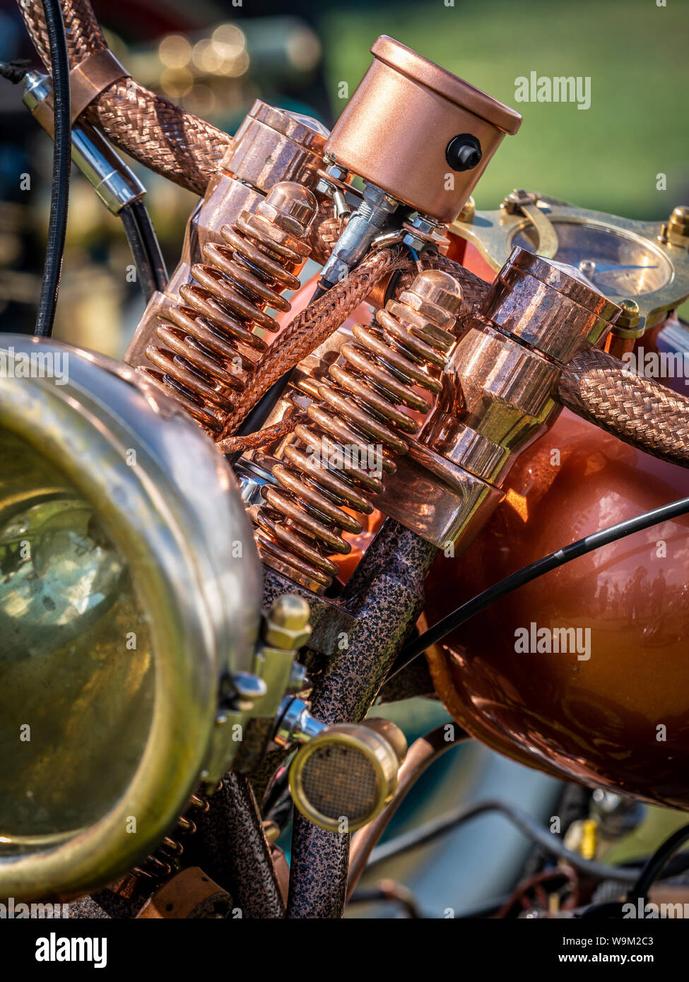 Copper coloured suspension springs on steampunk motorbike at Whitby steampunk weekend, UK. Stock Photo