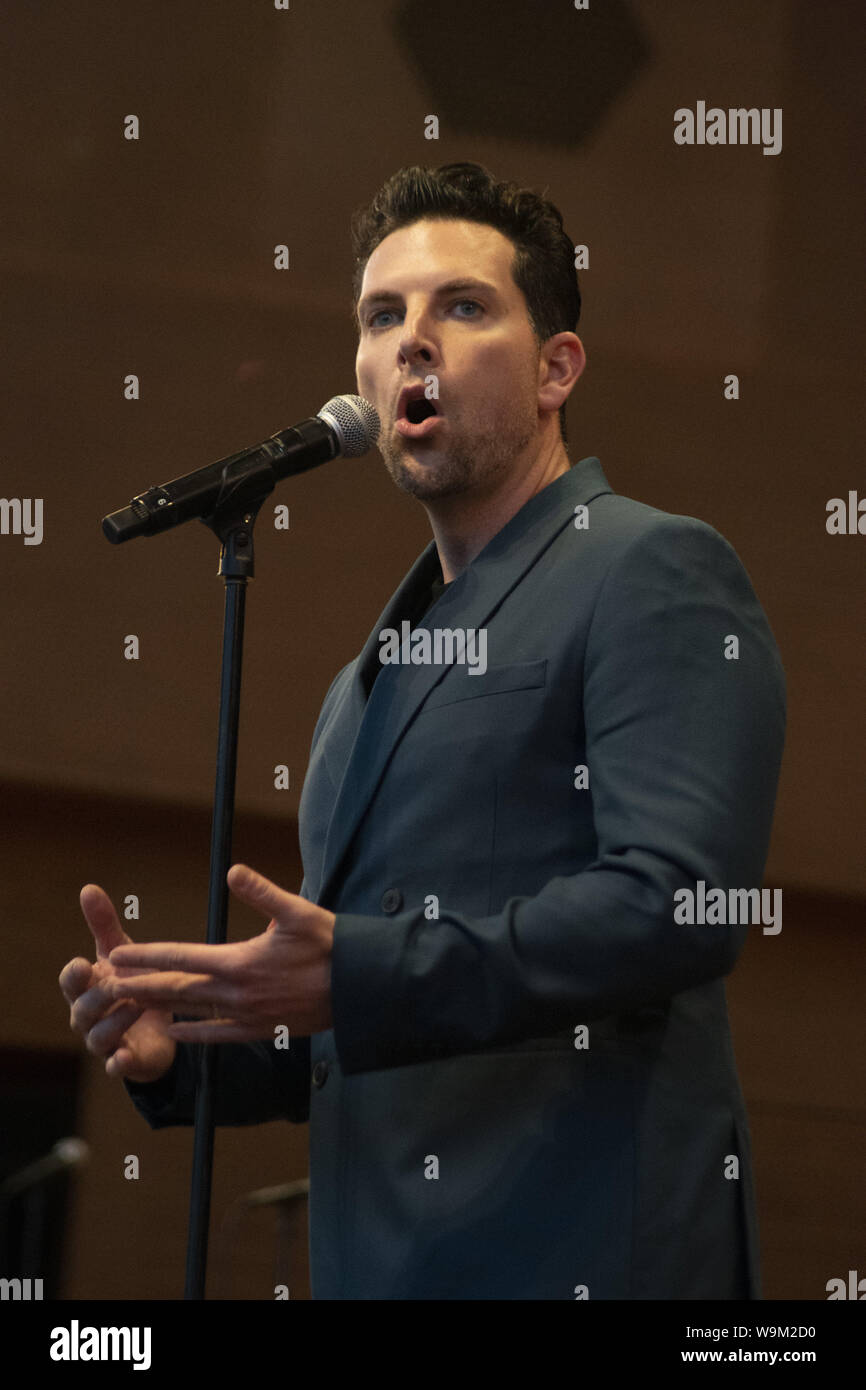 Chicago, IL, USA. 12th Aug, 2019. Despite reports of serious storms, a massive crowd gathered in Millennium Park, Chicago to see the free Broadway in Chicago concert on August 12, 2019. The lead singers from 13 musicals wowed the audience with their performances. ABC-TV reporter Janet Davies and Teatro Zinzanni's Frank Ferrante were the MCs for this event. The show previewed some of the shows coming to Chicago including Frozen, Jesus Christ Superstar, Mean Girls and the Donna Summer Musical. Pictured: Chris Mann from Phantom of the Opera. Credit: Karen I. Hirsch/ZUMA Wire/Alamy Live News Stock Photo