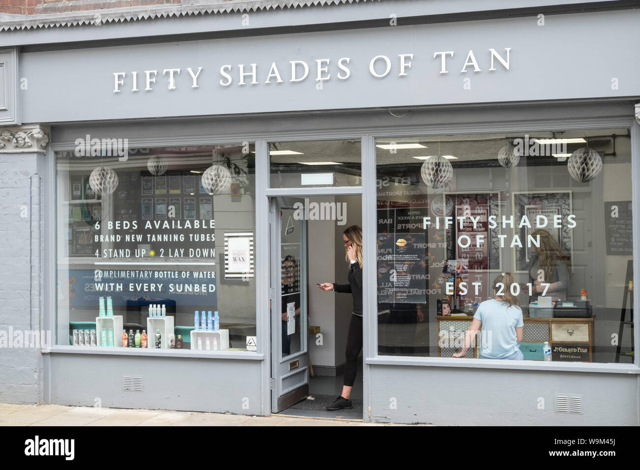 Tanning in a park hires stock photography and images Alamy