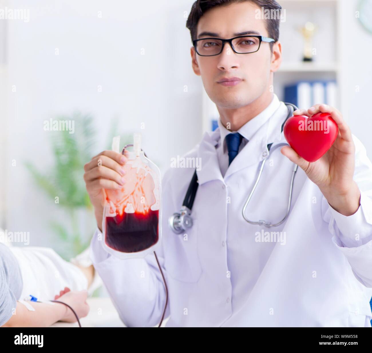 The patient getting blood transfusion in hospital clinic Stock Photo