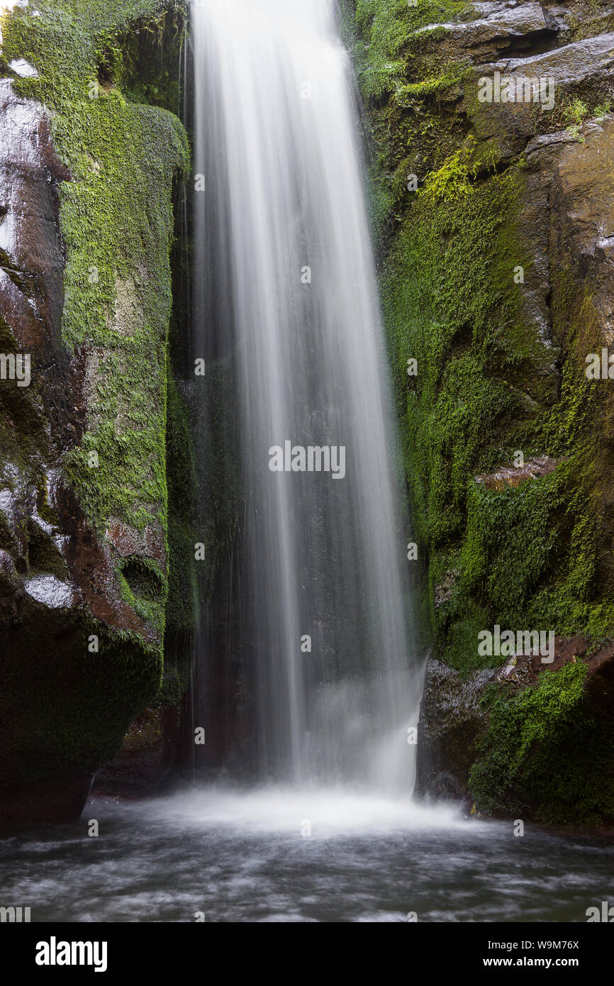 Close up of a beautiful base of long exposure mountain waterfall ...