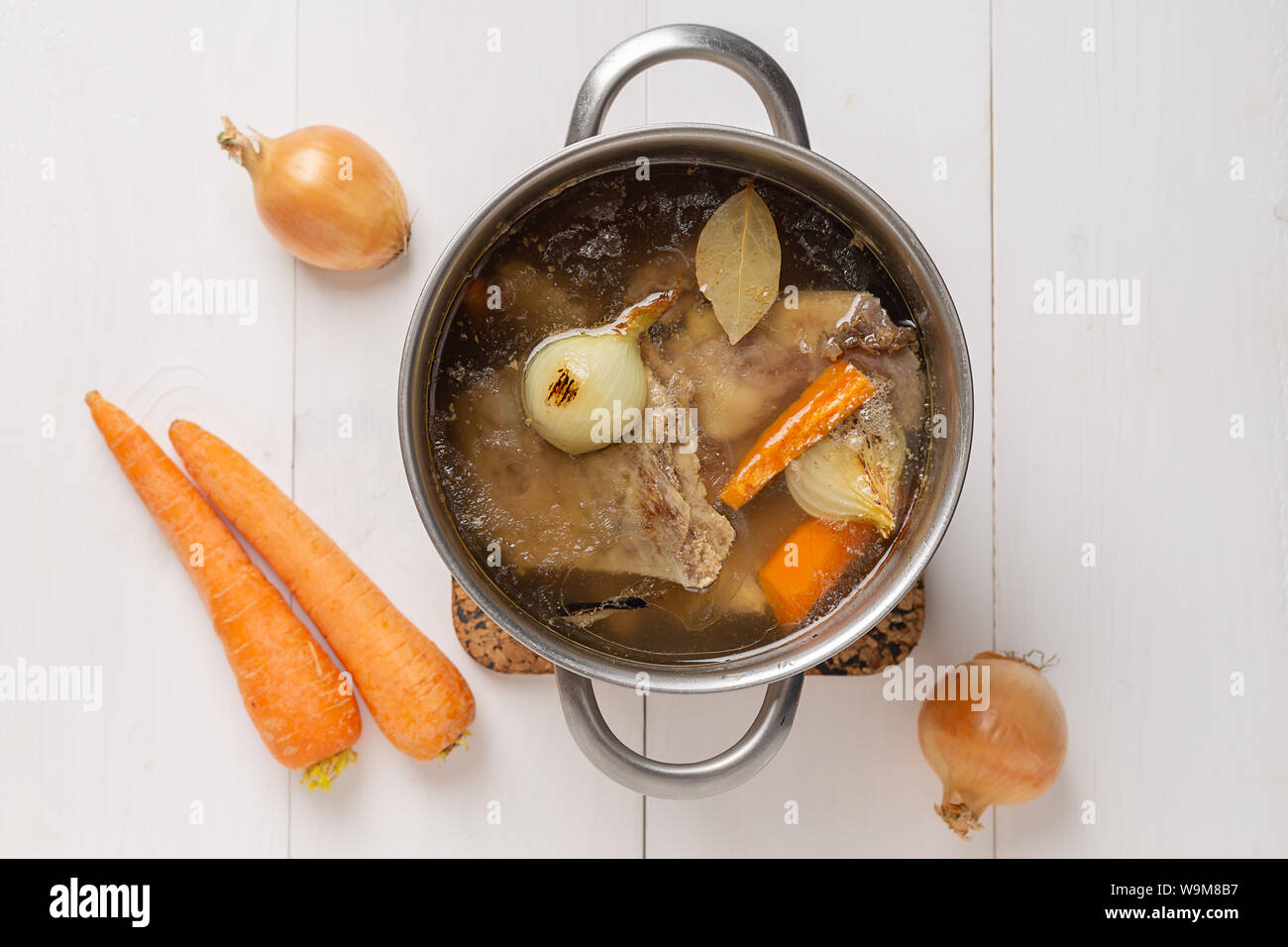 Bone Broth Bouillon in Metal Pan on white background Stock Photo Alamy
