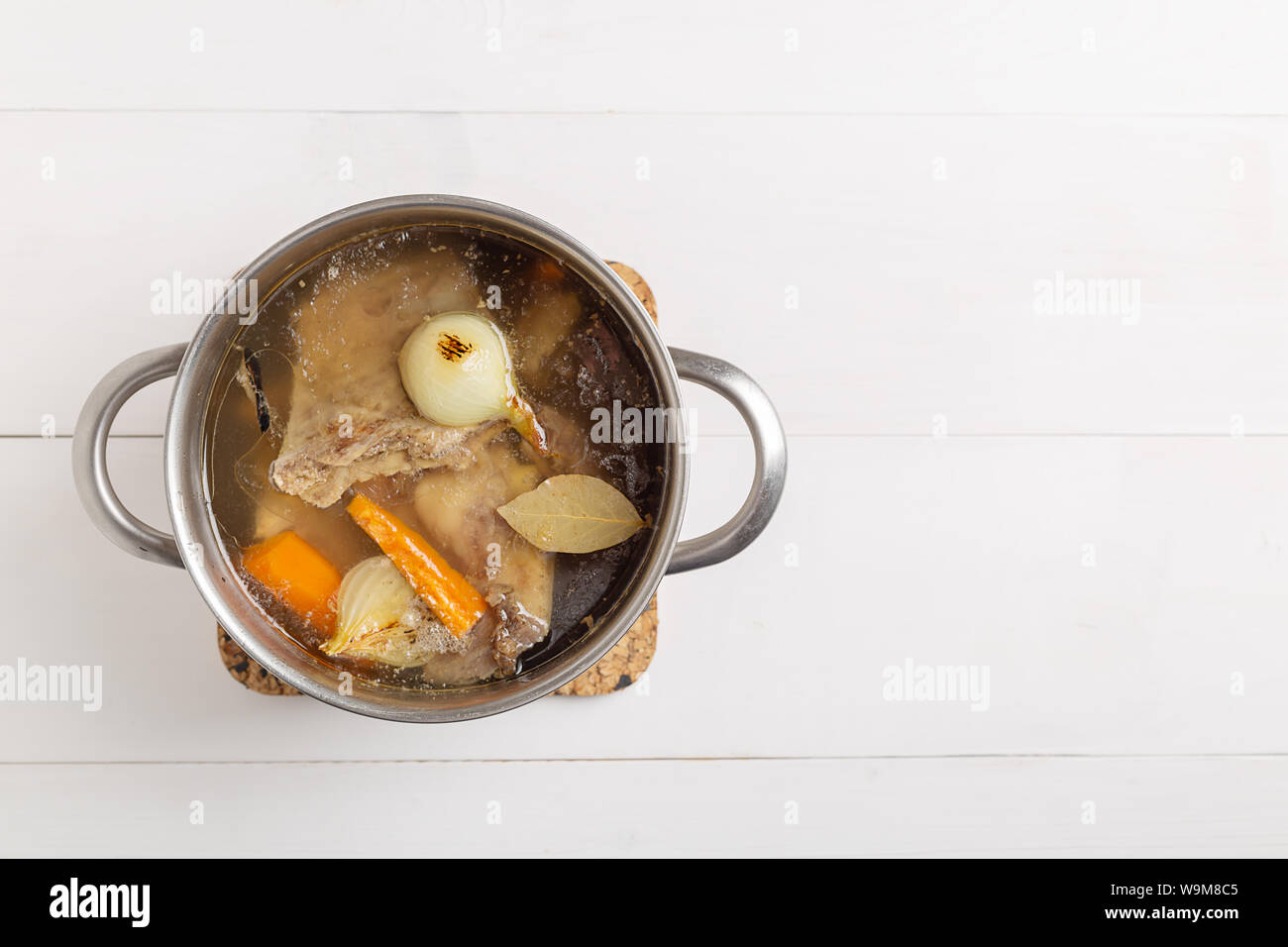 Bone Broth Bouillon in Metal Pan on white background Stock Photo Alamy