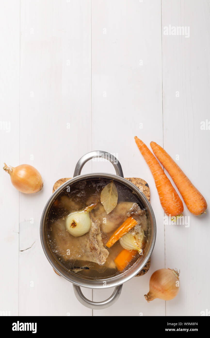 Bone Broth Bouillon in Metal Pan on white background Stock Photo Alamy