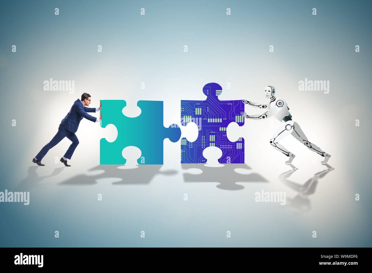 The robot and human cooperating in jigsaw puzzle Stock Photo - Alamy