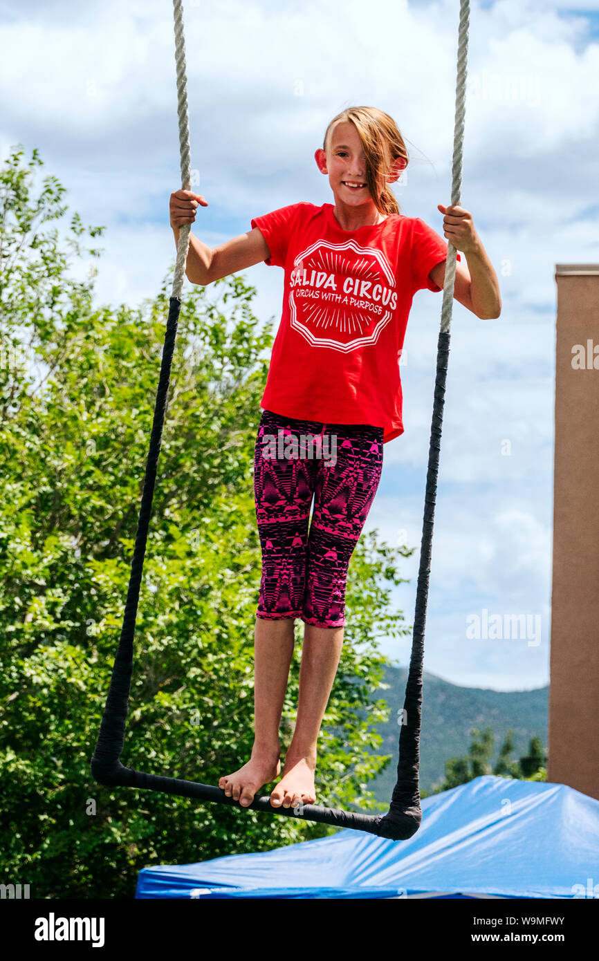 Young girl performing on trapeze; Salida Circus summer camp finale; Salida; Colorado; USA Stock Photo