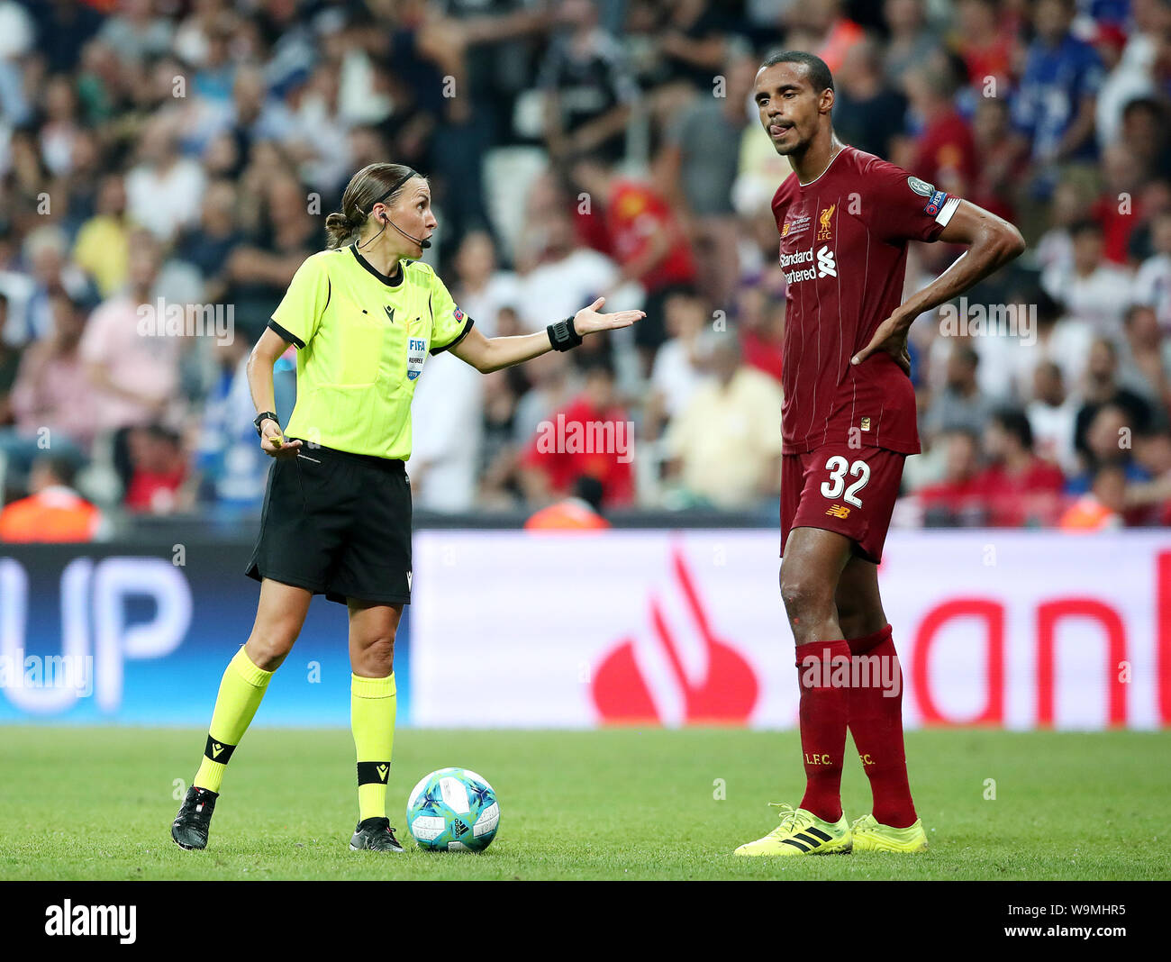 Liverpool's Joel Matip (right) reacts to a decision from match referee Stephanie Frappert during the UEFA Super Cup Final at Besiktas Park, Istanbul. Stock Photo