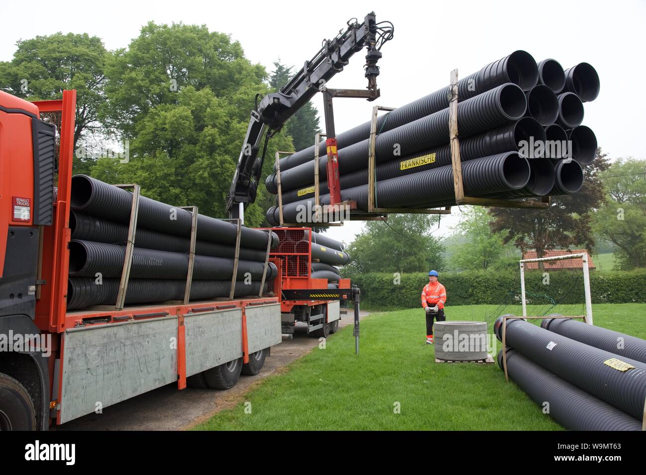Semirigid, large bore PVC evacuation pipes being delivered to the site