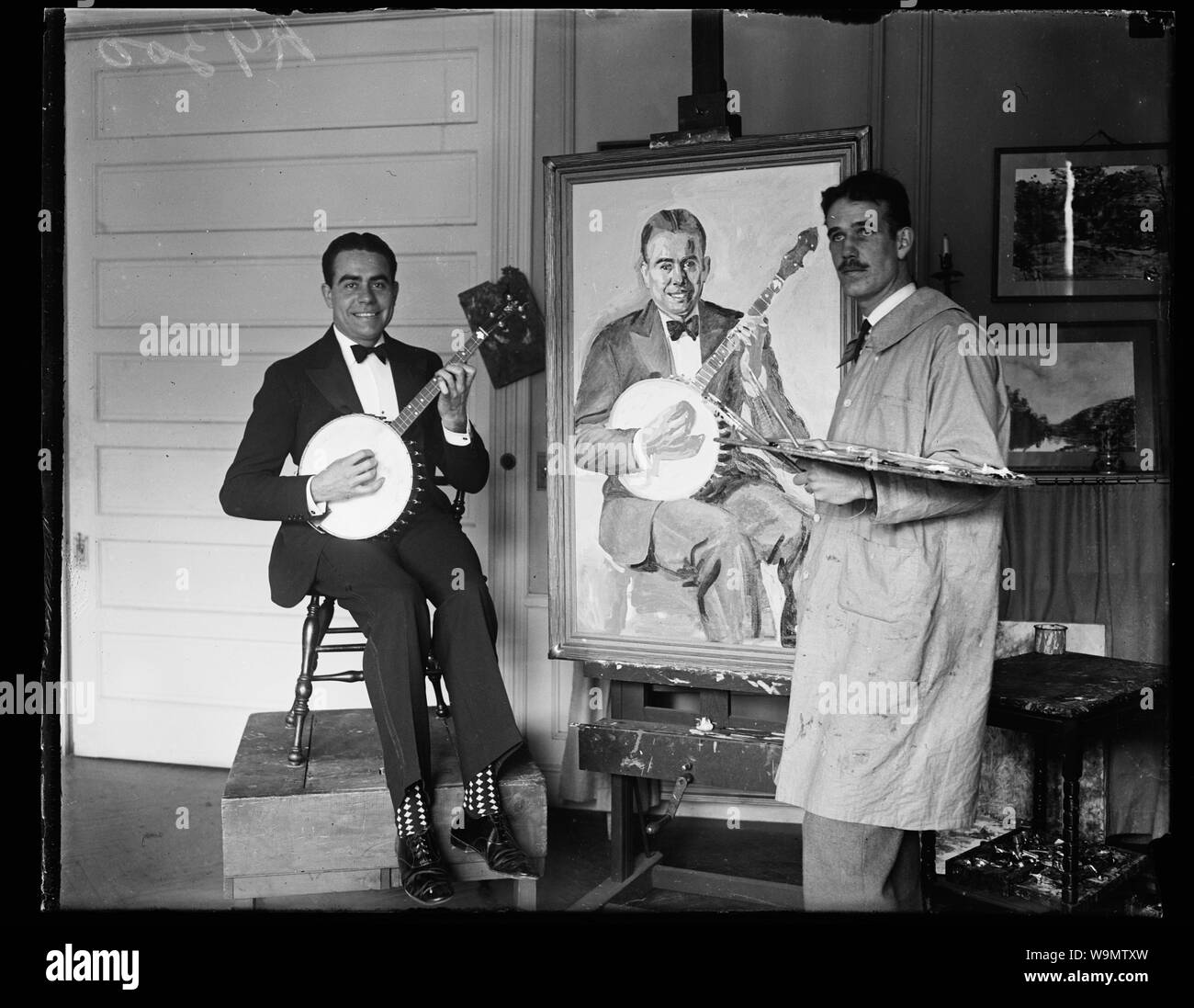 Artist painting man with banjo Stock Photo Alamy