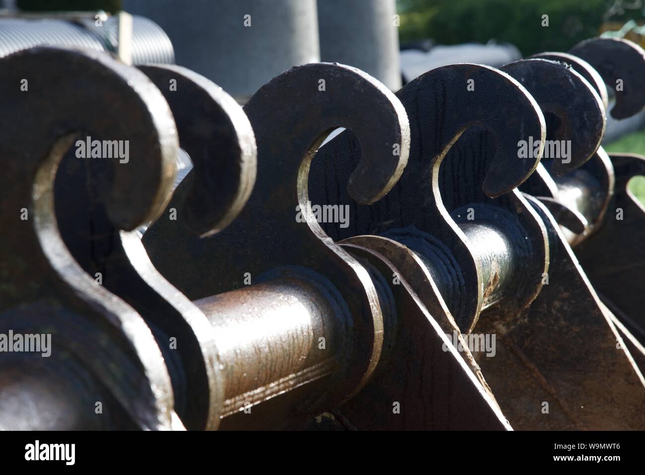 different sizes of excavator buckets and are lined up ready for use on ...