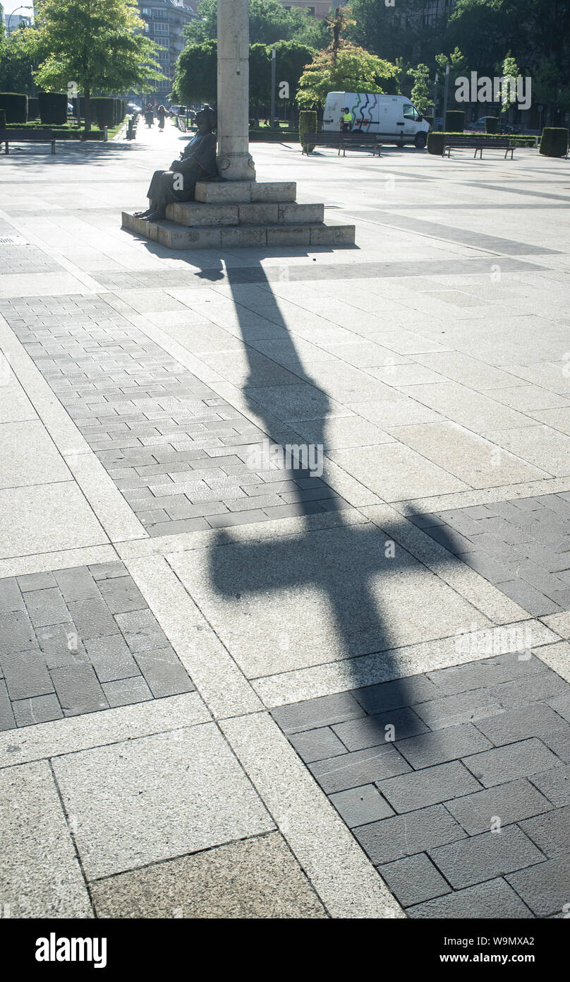 Leon, Spain - June 26th, 2019: Monument To The Pilgrim at San Marcos Square, Leon City, Castile and Leon, Spain. Shadow of the Cross on floor Stock Photo