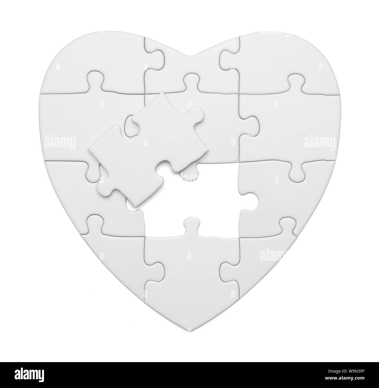 Blank Heart Puzzle Isolated on White Background. Stock Photo
