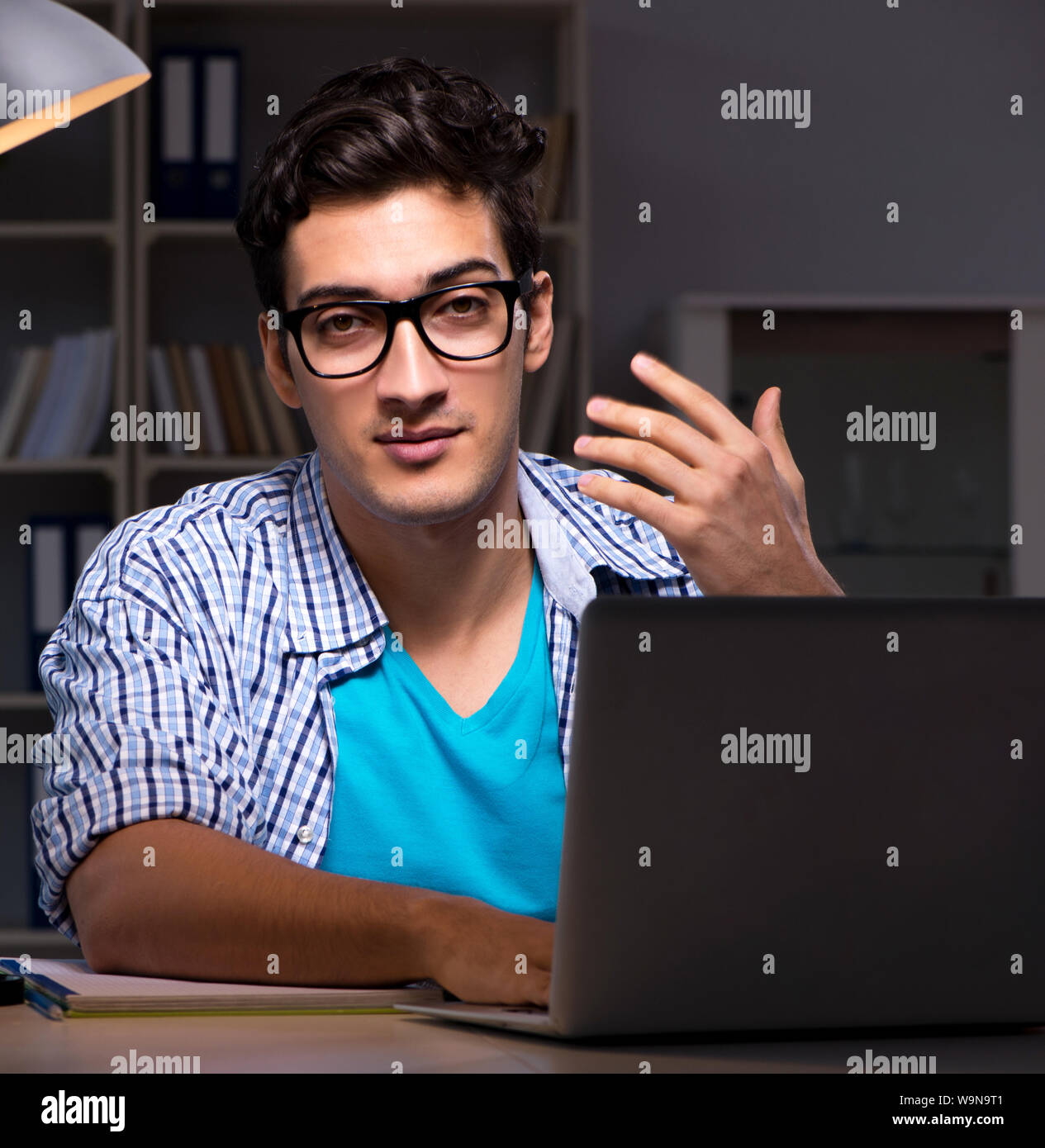 The student preparing for exams late night at home Stock Photo - Alamy