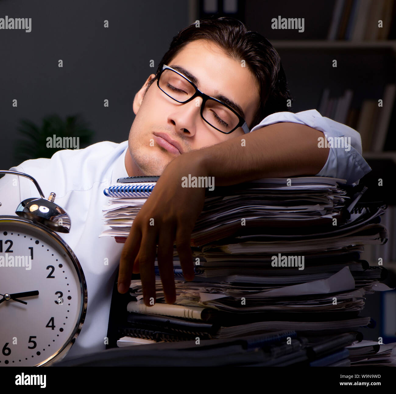 The young businessman working overtime late in office Stock Photo - Alamy