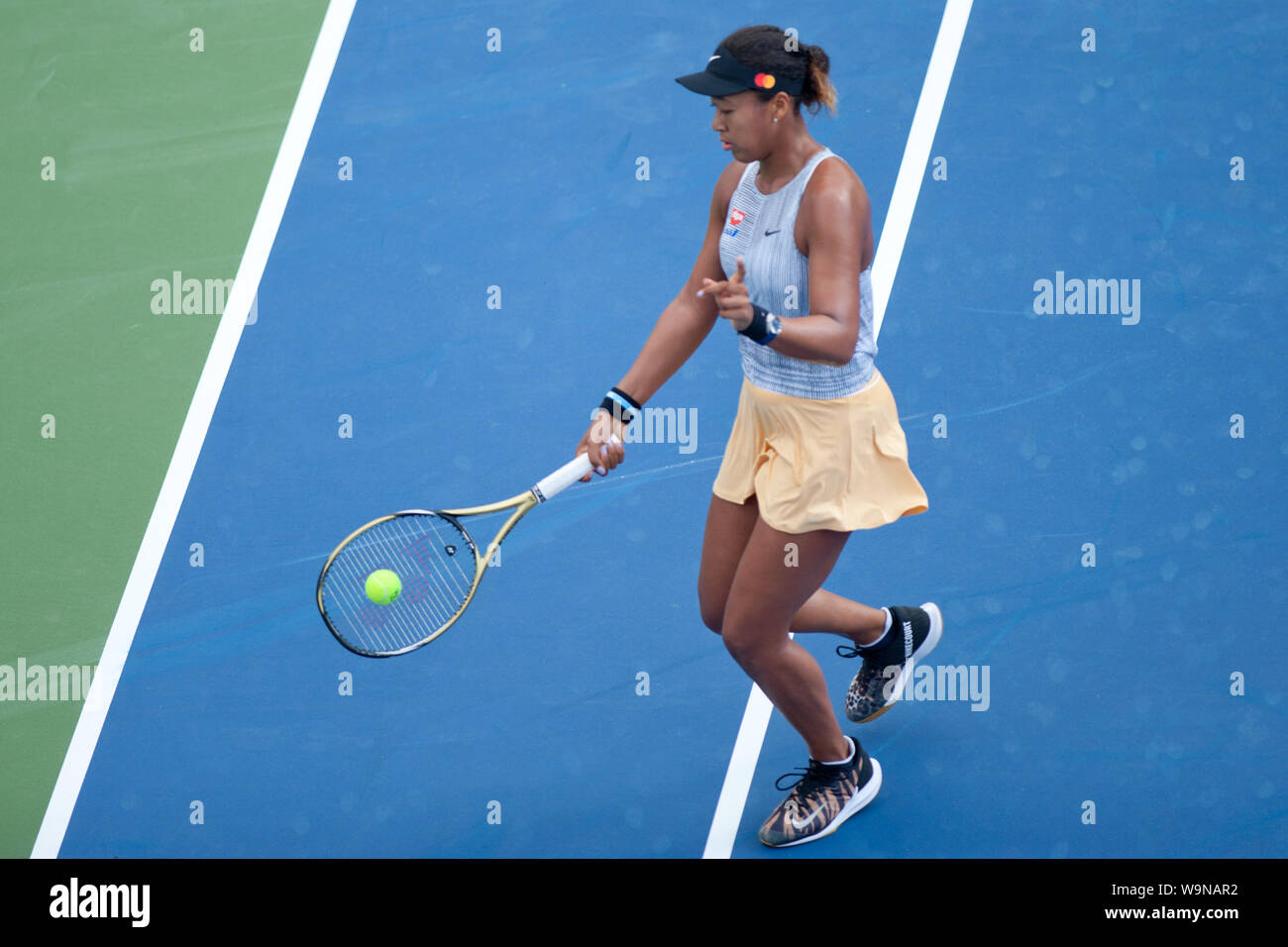 Cincinnati, OH, USA. 14th Aug, 2019. Western and Southern Open Tennis,  Cincinnati, OH; August 10-19, 2019. Naomi Osaka plays a ball against  opponent Allaksandra Sasnovich during the Western and Southern Open Tennis