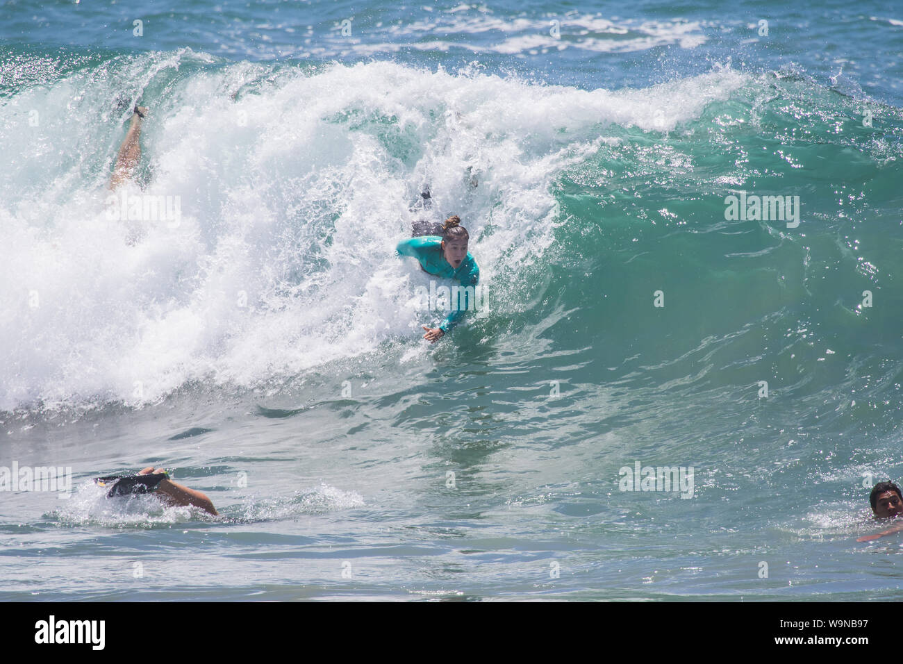 woman Bodysurfing at the world famous Wedge in Newport Beach California