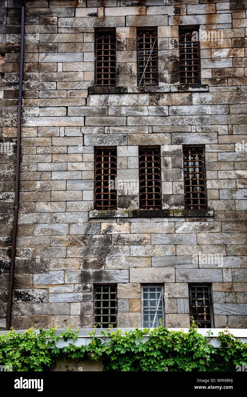 Windowless Penitentiary Facade of a penitentiary with the windows and bars connecting to the ...