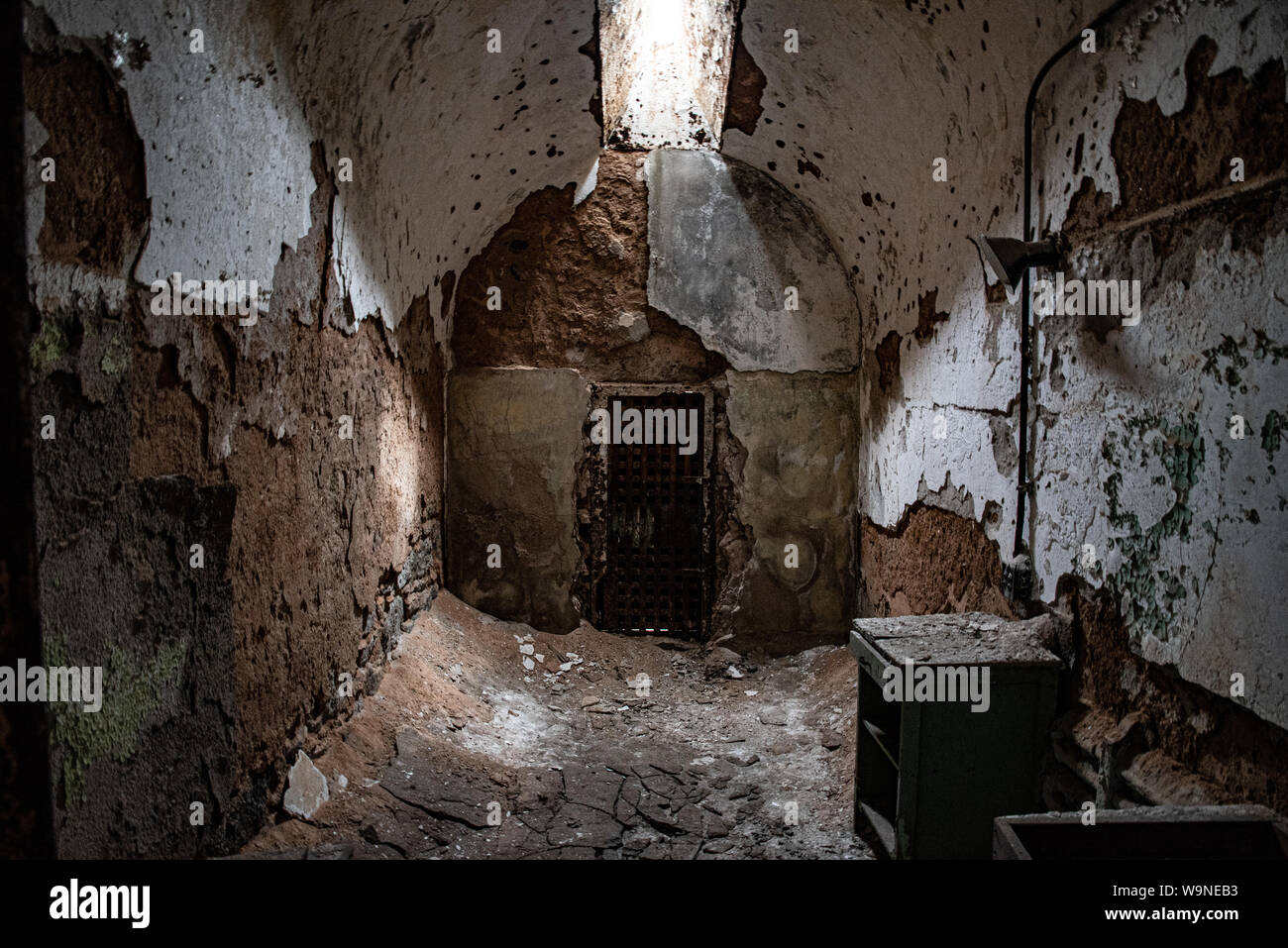 Cell in an abandoned penitentiary in severe disrepair Stock Photo - Alamy