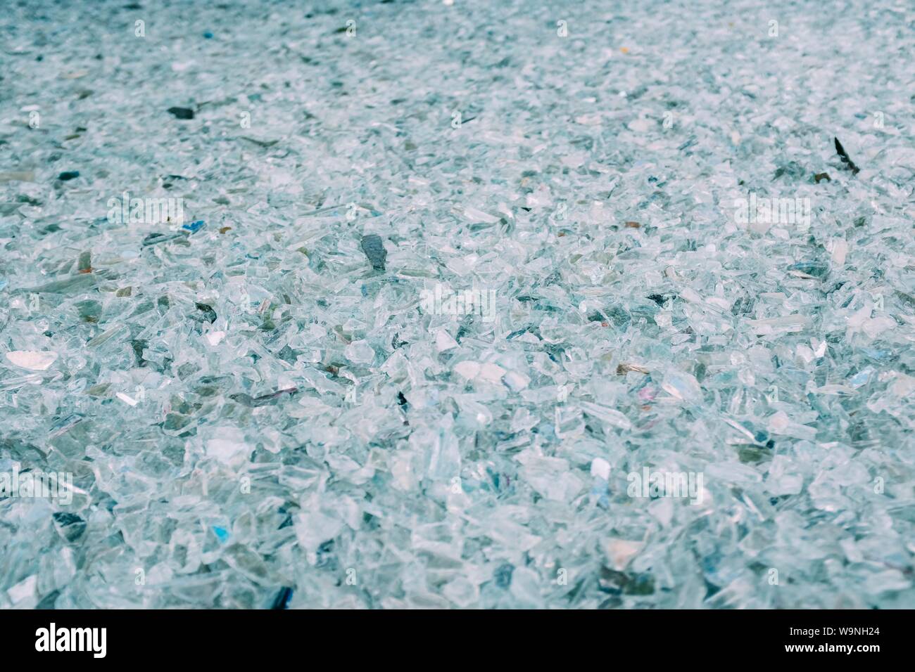 Closeup shot of a pile of broken glass in a large field Stock Photo - Alamy