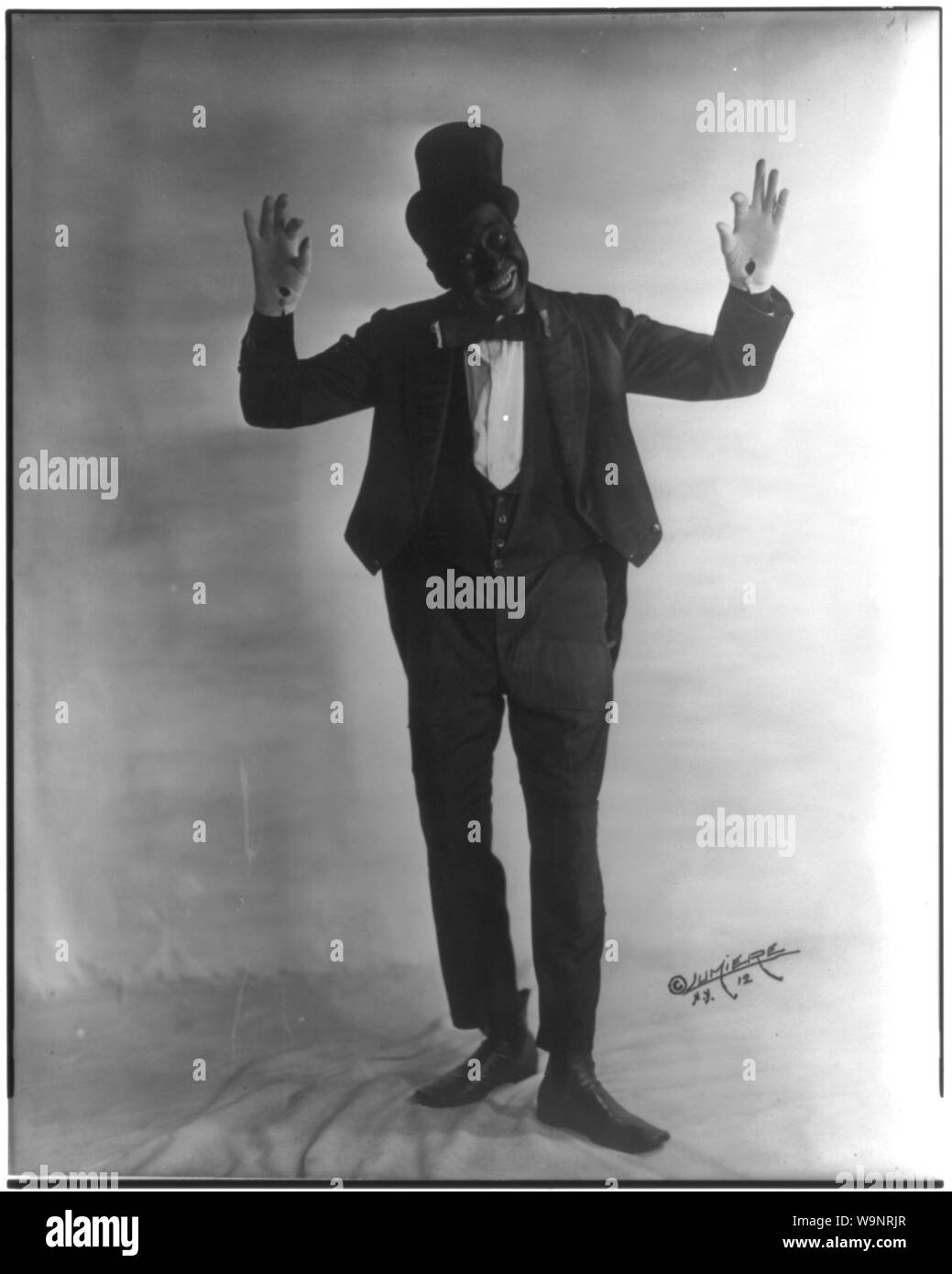 Bert Williams in a dynamic pose, capturing his energetic and engaging stage presence.