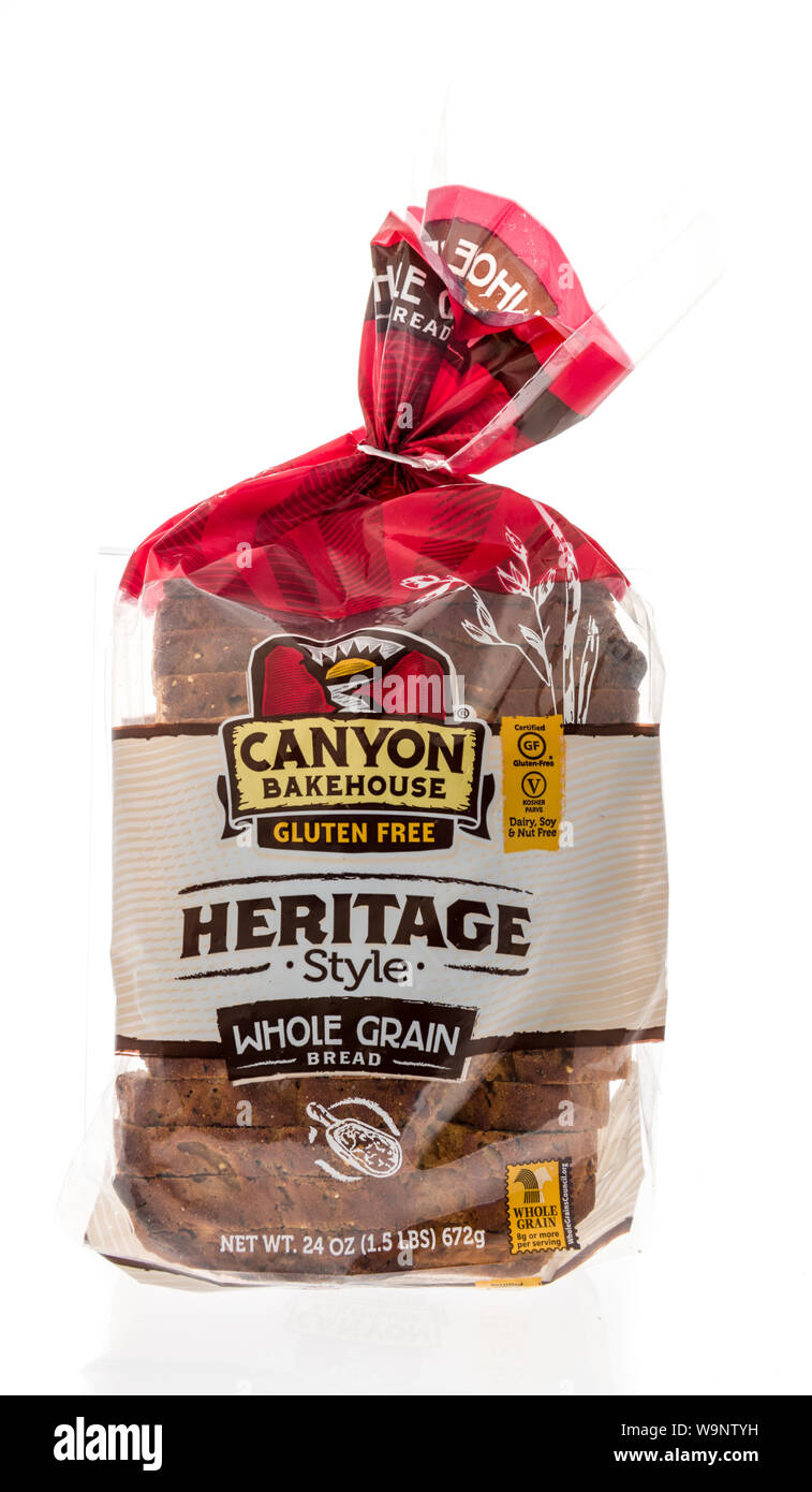 Winneconne, WI - 14 August 2019 : A package of Canyon Bakehouse heritage style whole grain sliced bread loaf on an isolated background Stock Photo