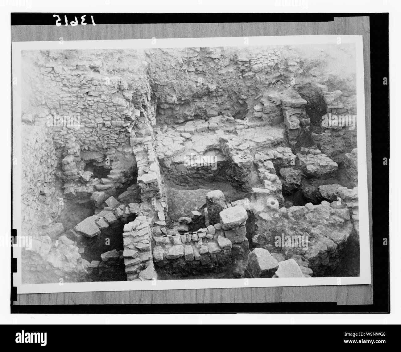 Bethel excavations in 1954 by Dr. James L. Kelso. House walls & paved flagstone doors from Canaanite houses destroyed by Joshua's troops. Wall in the upper left is Israelite Stock Photo