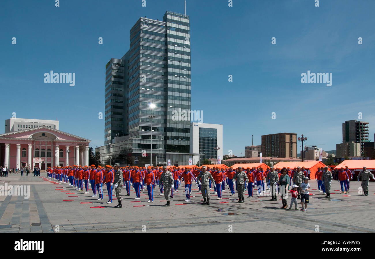 Uniformed fire and emergency services personnel parade in the downtown Sukhbaatar Square, Ulaanbaatar, Mongolia Stock Photo