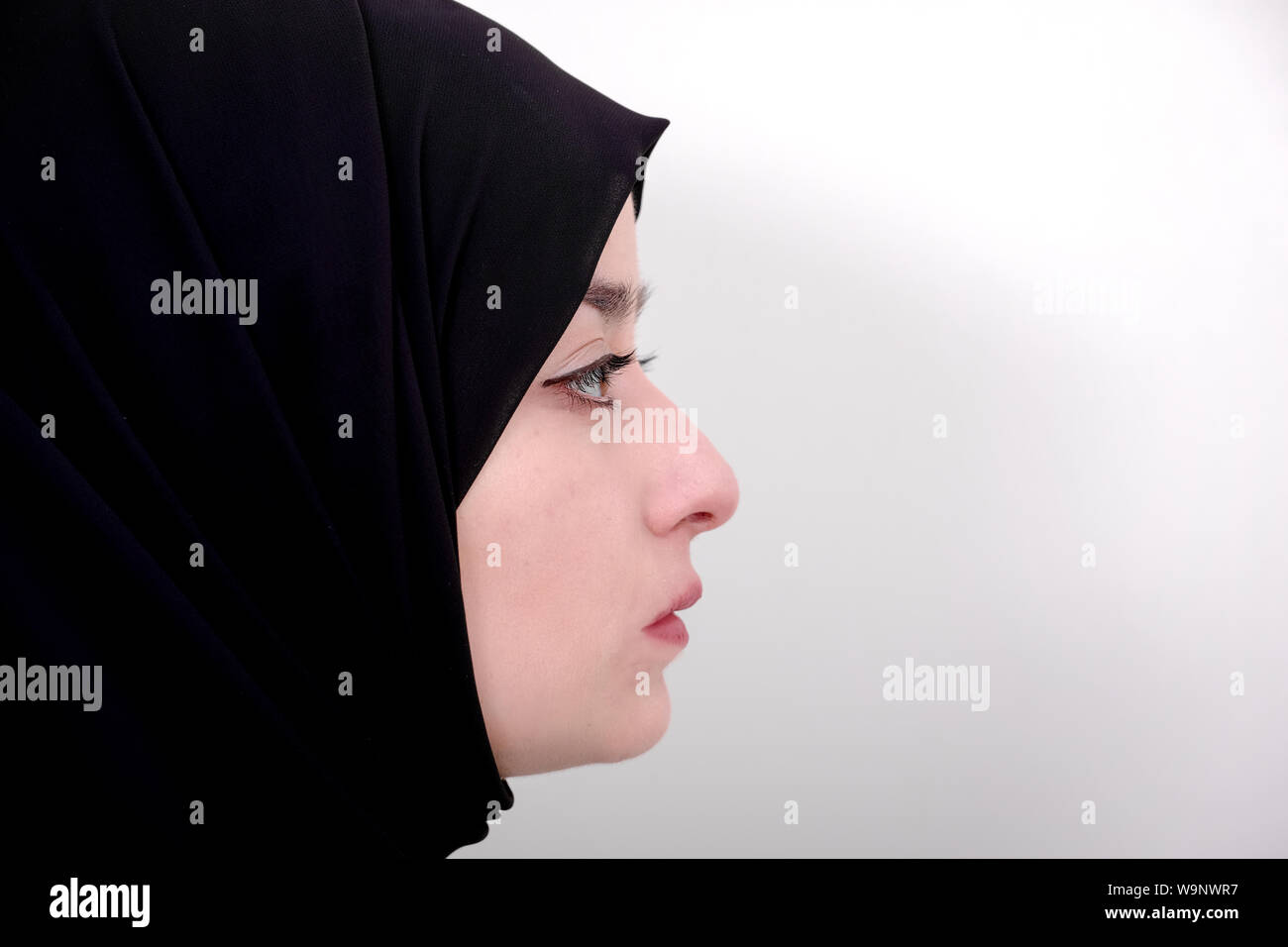 Profile photo of hijab muslim woman, muslim girl wear black scarf or veil Stock Photo