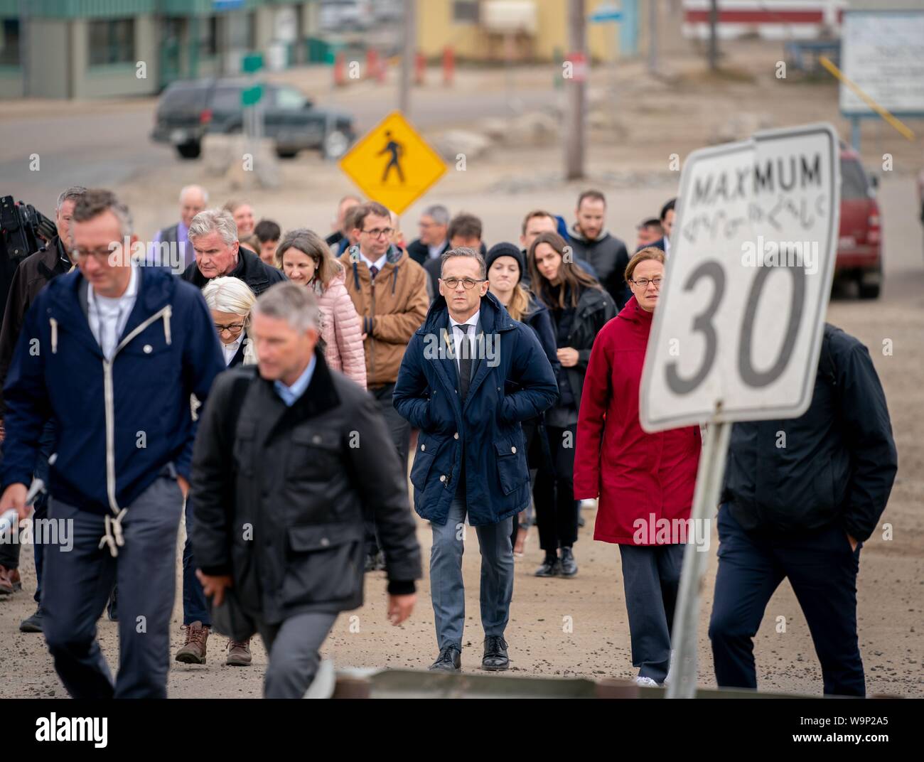 Iqaluit, Canada. 14th Aug, 2019. Heiko Maas (M, SPD), Foreign Minister of Germany, will take his delegation through the city of Iqaluit in northern Canada. In the Arctic region, the Foreign Minister wants to get a picture of the extent of climate change. Credit: Kay Nietfeld/dpa/Alamy Live News Stock Photo