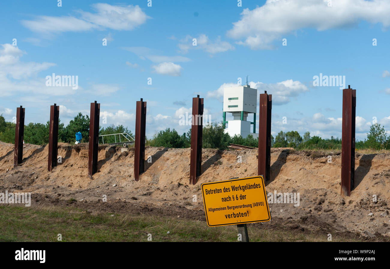 Gorleben, Germany. 08th Aug, 2019. Steel girders of a wall surrounding the former Gorleben exploratory mine are standing on the mine site. In the coming period, the wall that enclosed the site will be completely demolished. (to dpa 'The wall falls - dismantling in Gorleben progresses') Credit: Philipp Schulze/dpa/Alamy Live News Stock Photo