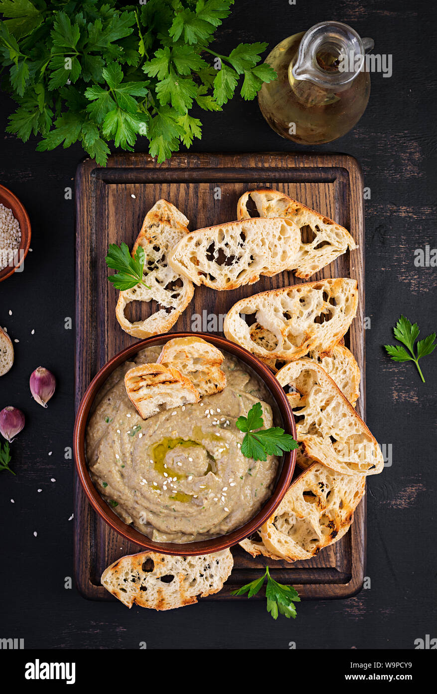Baba ghanoush vegan hummus from eggplant with seasoning, parsley and