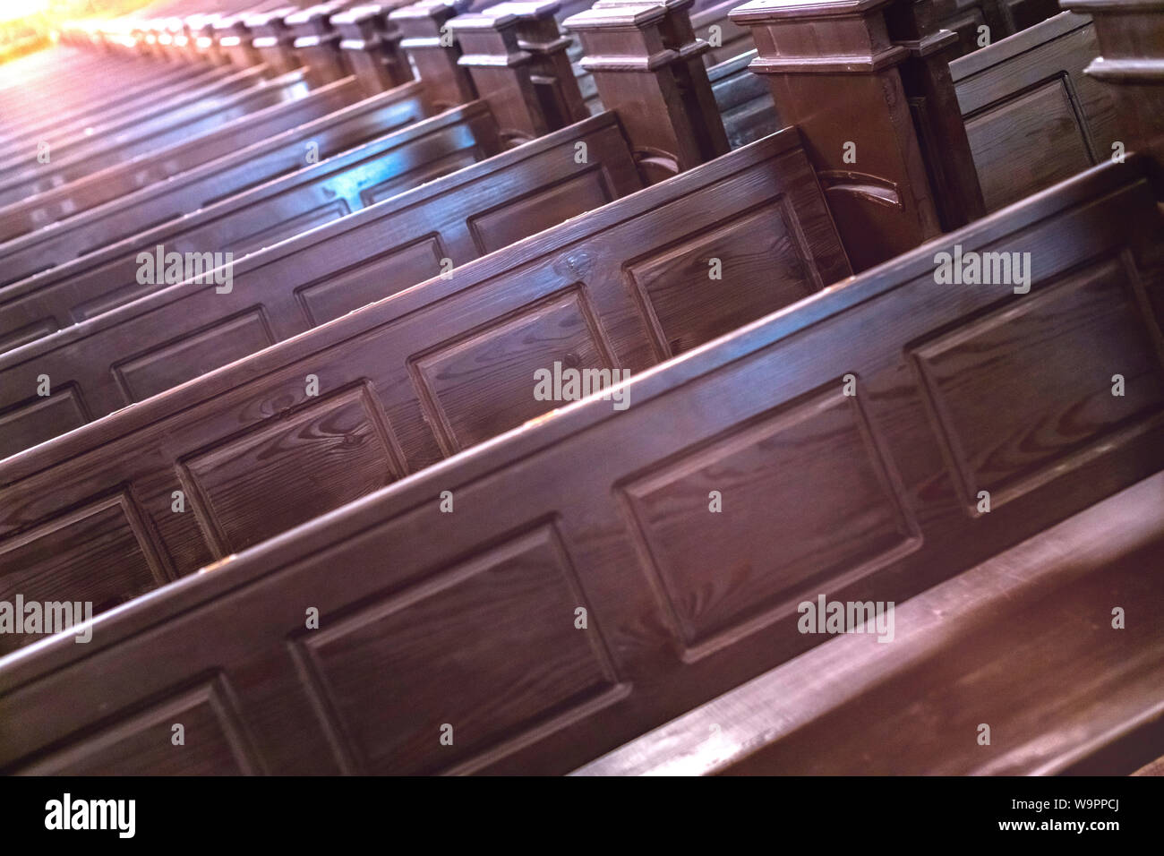 Cathedral pews. Rows of benches in christian church. Heavy solid