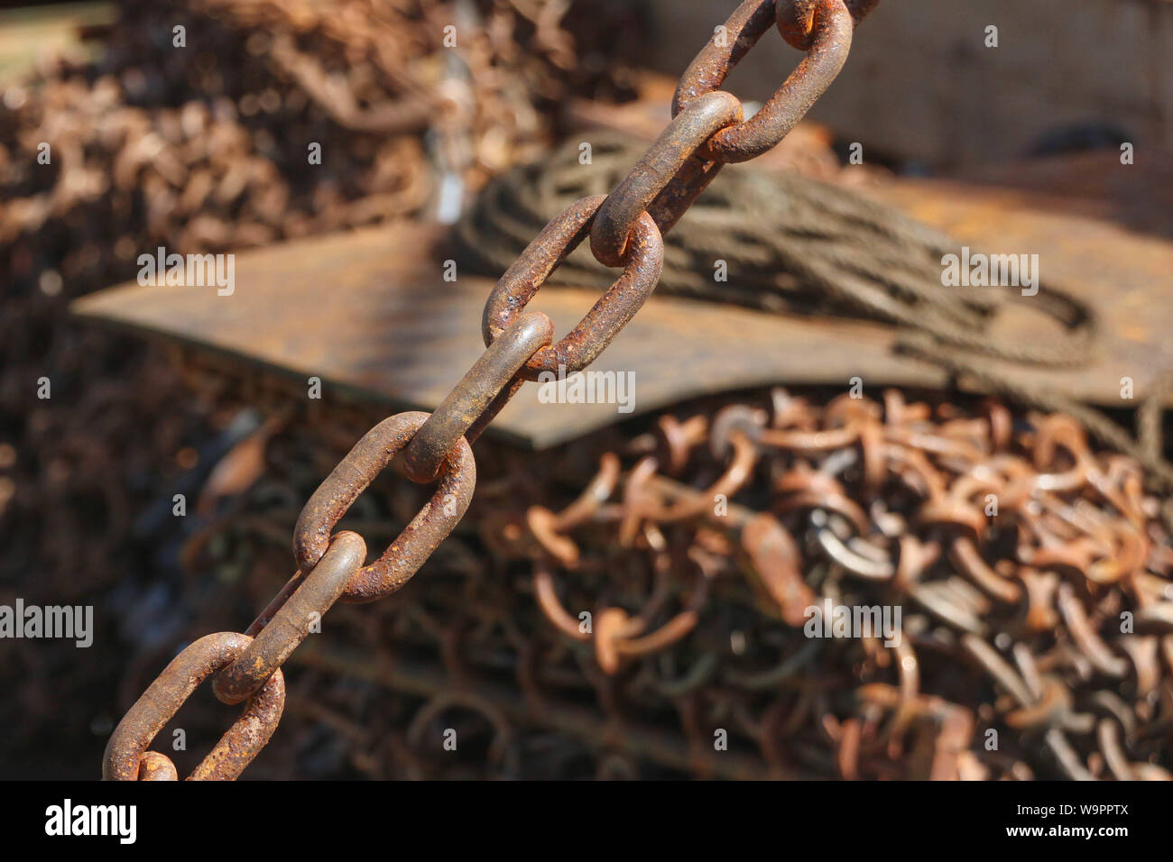 Close-up of coiled rusty chain Stock Photo