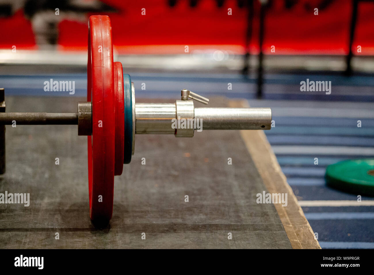 bar with plates on ground for deadlift competition Stock Photo