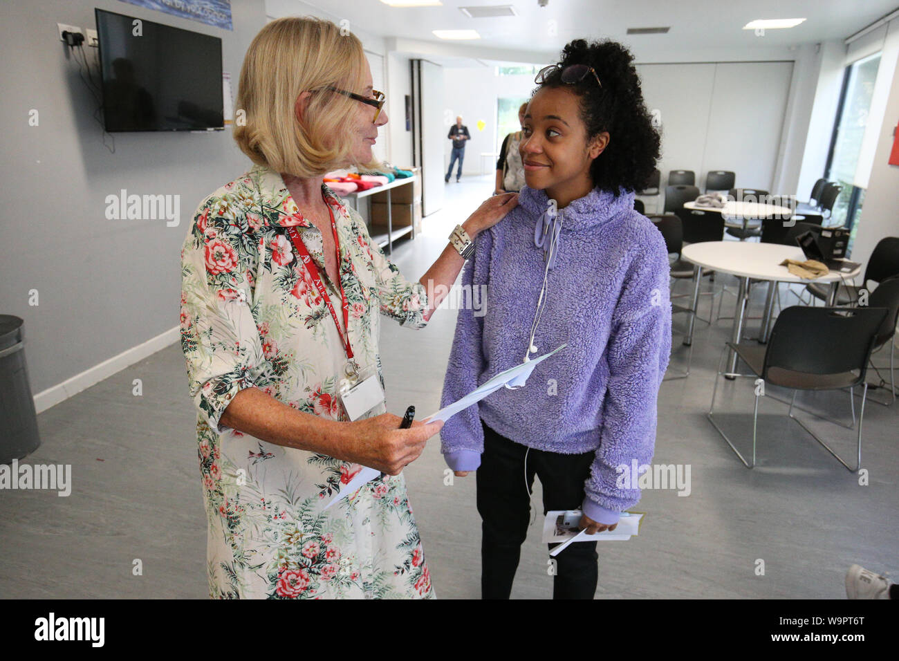 Bruna Miguel (right), whose A Level results have qualified her for a place at the London School of Economics, is congratulated by school principal Delia Smith at the Ark Academy in Wembley, London. Stock Photo