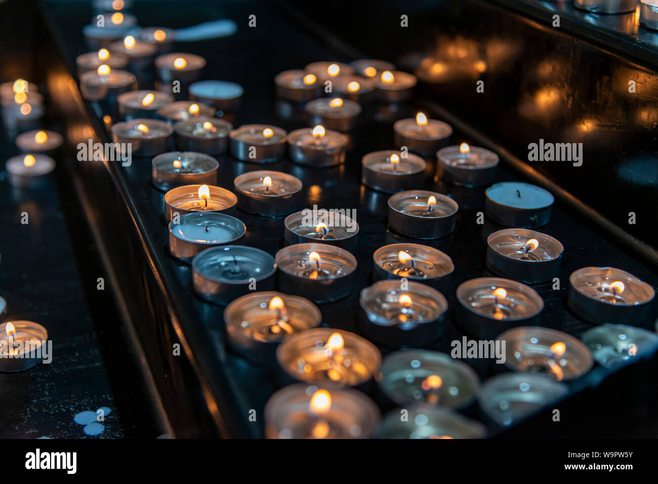 Prayer candles in a church Stock Photo