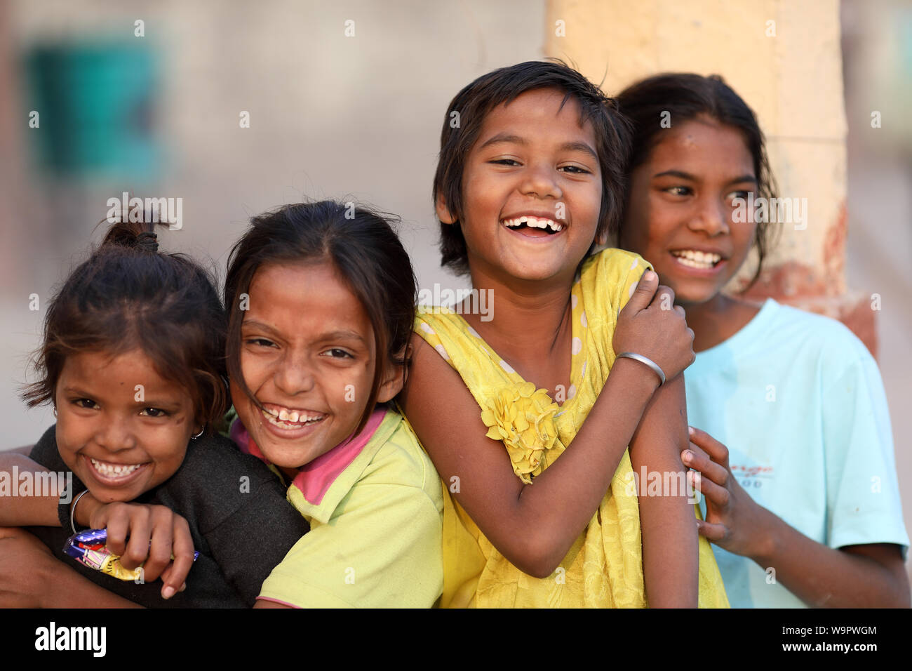Happy girls have fun at the ghats of Varanasi in Varanasi, India. Varanasi is the holiest of the seven sacred cities in India. Stock Photo