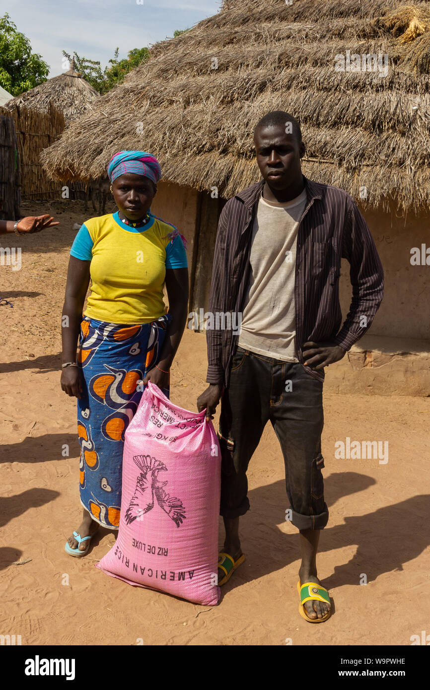 GAMBIA JAN 7, 2014 Tourists give bag of 50kg rice to