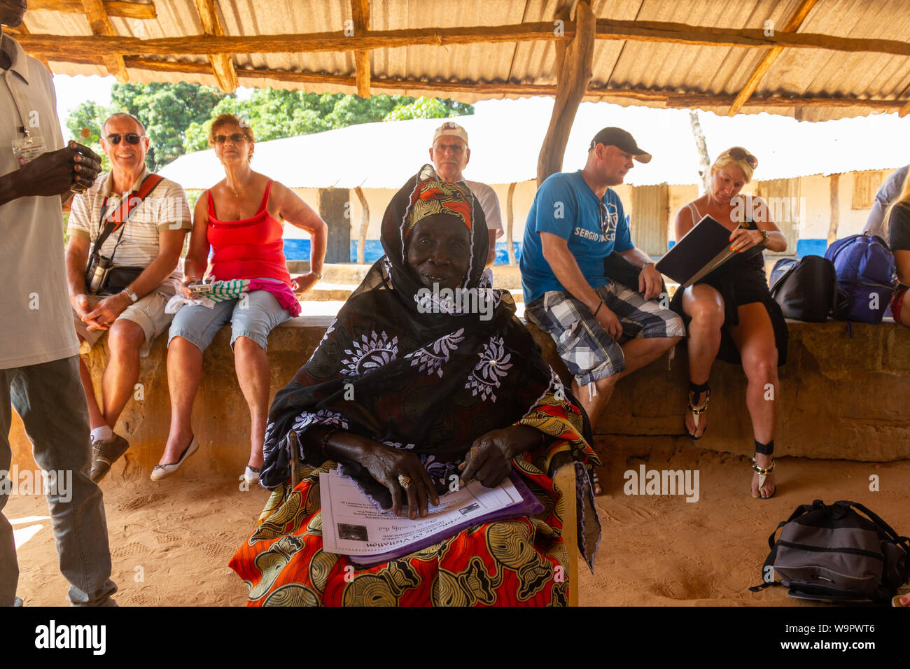 JUFUREH, GAMBIA- JAN 12, 2014: Ansestor of Kunte Kinte selling certificate of authenticity of her origin Stock Photo