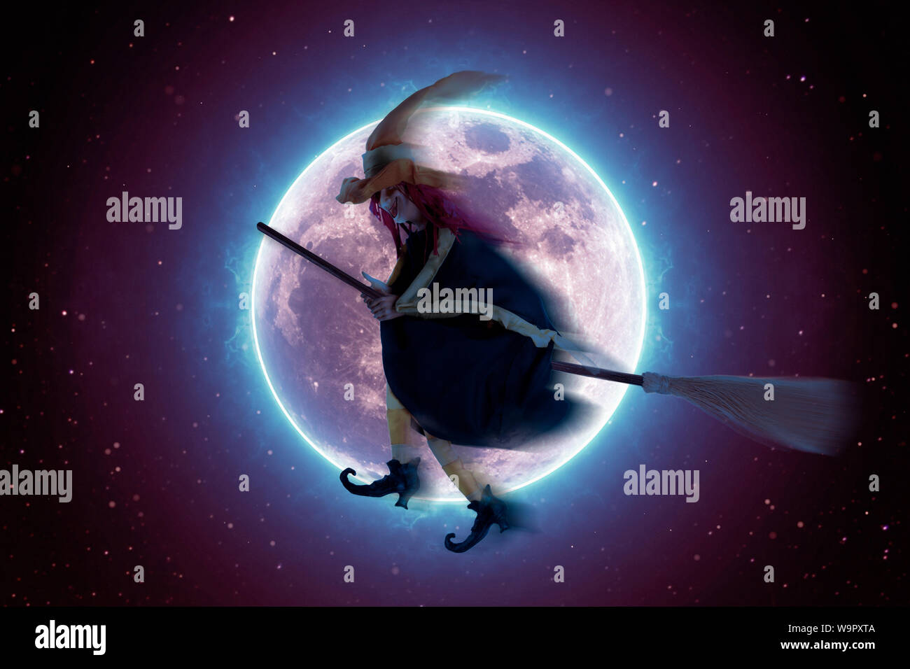Scary witch flying on a broomstick on the background of a full moon ...