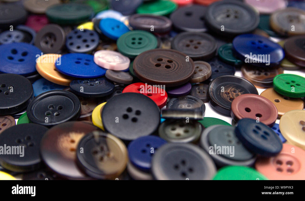 Background from multi-colored randomly scattered buttons. Stock Photo