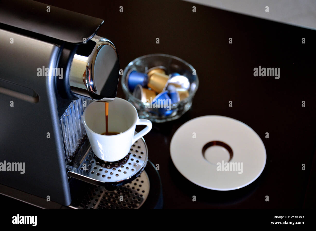Espresso machine in action, filling a good cup of coffee Stock Photo - Alamy