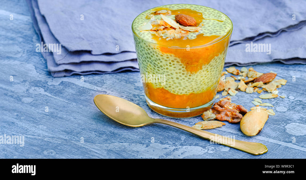 Chia seed pudding with cocnut milk and cloudberry or mango jam is great for vegan breakfast or dessert. Easy and fast to make a healthy snack Stock Photo